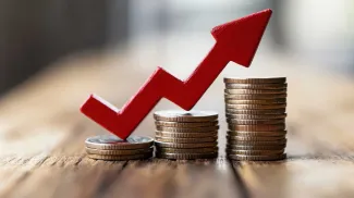 Cash coins with red stepping up arrow
